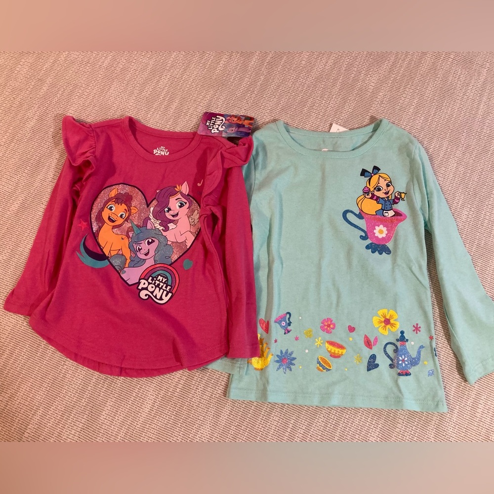 Two long sleeve shirts. Girls size 2T and 4T.